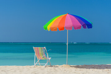 Umbrella and lounge chair with snorkel at the beach