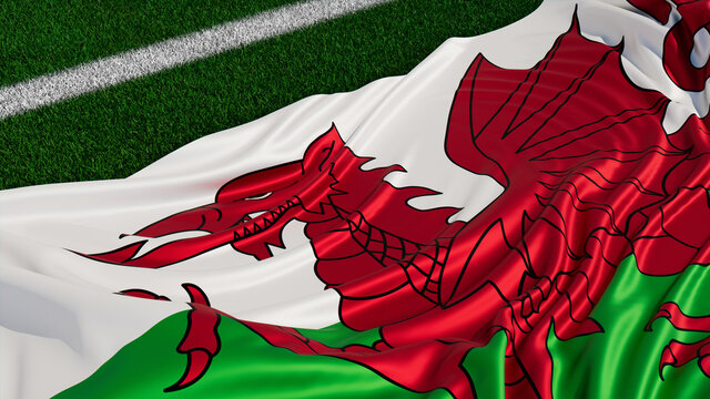 Flag of Wales on a Sports field. Grass Pitch with a Welsh Flag. Euro 2020 Football Background.
