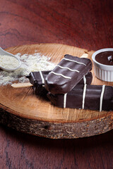 .Ice cream covered with chocolate. Chocolate and stuffed popsicles. Milk flavor. Copy space