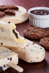 .Vanilla ice cream covered with white chocolate and filled with hazelnut cream. Popsicle.