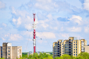 Fototapeta na wymiar Siauliai radio and Tv tower architecture with buildings in Lithuania