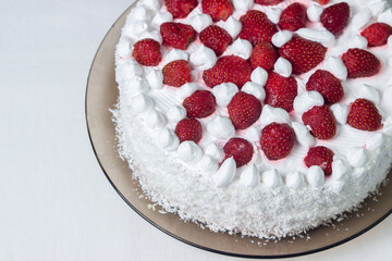 Creamy strawberry cake. Homemade cake with whipped cream and fresh strawberries. Light dessert