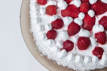 Obraz na płótnie Canvas Creamy strawberry cake. Homemade cake with whipped cream and fresh strawberries. Light dessert