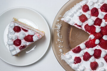 Creamy strawberry cake. Homemade cake with whipped cream and fresh strawberries. Cut piece of cake