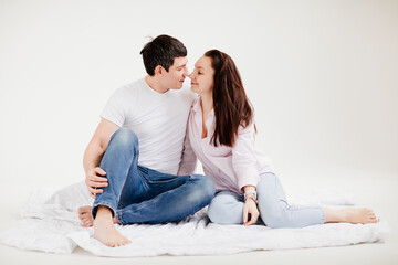 couple man and woman in white photo studio. family psychotherapy. 