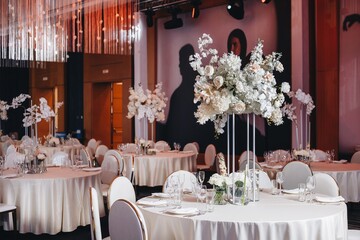 tableware Glasses, flower fork, knife served for dinner in restaurant with cozy interior