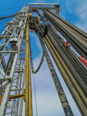 Drilling rig for drilling oil and gas. Inside view. There are drill plugs for lowering into the well. The unit is equipped with a top power drive