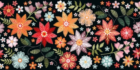 Colorful seamless embroidery border with bright flowers and leaves. Floral embroidered pattern on black background. Fashion print.