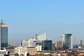 Foto op Plexiglas High commercial buildings behind the residential buildings © keremberk