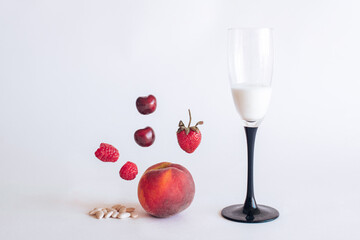 cherry, peach, raspberry, strawberry on white background