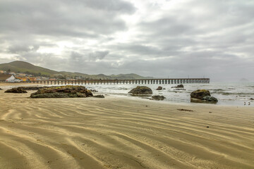 The wooden pier on the Cayucos State Beach, Cayucos California