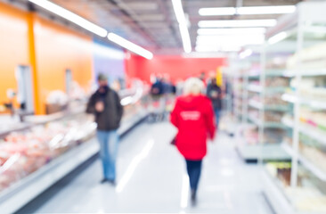 abstract defocused shoppers at supermarket