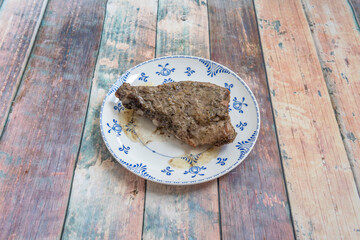 ribs marinated with parsley and garlic roasted in its juice on a beautiful ceramic plate
