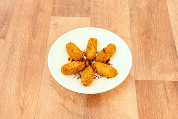 freshly made breaded croquettes seasoned with pieces of fried serrano ham