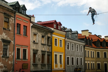 Equilibrist or balance master in old town in Lublin, Poland. June 2012