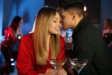 Man and woman flirting with each other in bar