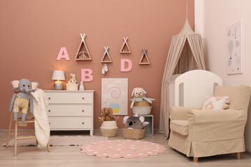 Baby room interior with stylish furniture and comfortable crib