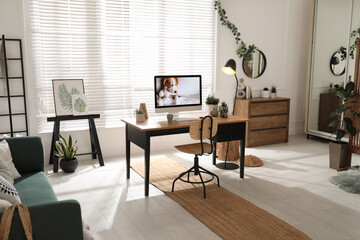 Stylish home office interior with comfortable workplace