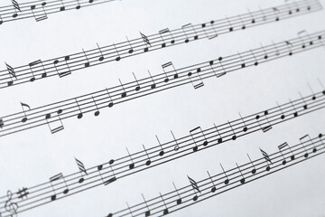 Fototapeta premium Paper sheet with musical notes, closeup view