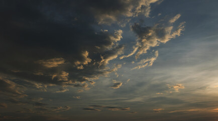 Beautiful sunset sky above clouds with dramatic light
