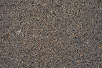 Texture of cement and compact asphalt. Gray and black color. Background for designs
