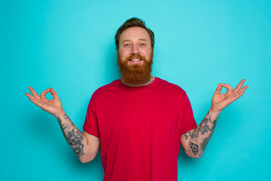 Man is relaxed and happy in yoga position