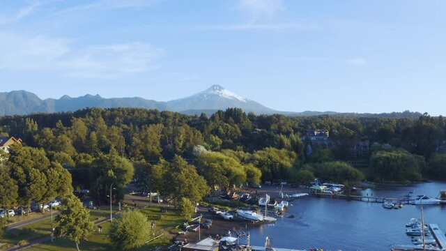 Dolly in with Drone from pucon bay to volcan villarrica