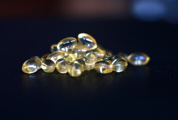 Fish oil on black background.