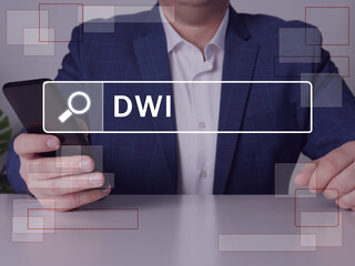 driving under the influence DWI inscription on the screen. Close up Budget analyst hands holding...
