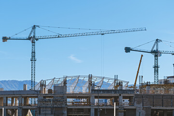 Construction site with tower cranes.