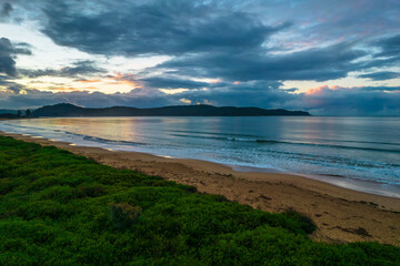 Rain Clouds and Sunrise at the Beach