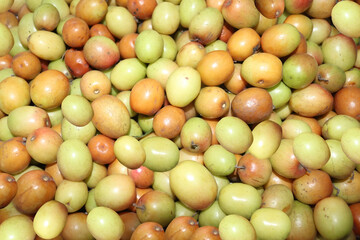 Organic plums fruit in local farmers market.