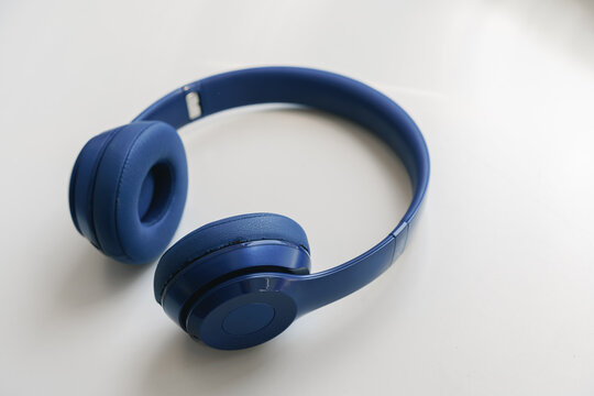 Blue Headphones On White Background Close Up