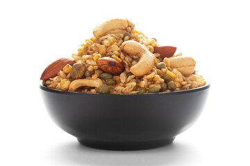 Close-Up of Shahi Mixture in a black ceramic bowl, made with peanut, cashew, almonds. Indian spicy snacks (Namkeen).