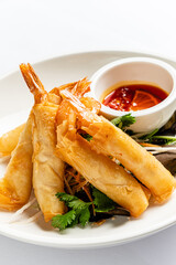 spring rolls with sauce and salad