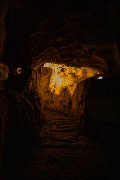 Inside view of Karain Cave in Antalya, with natural stalactites and stalagmites around in Turkey