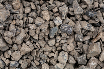 brick rubble debris on construction site. inorganic crushed stone, non-round, loose material with grains. Artificially obtained by crushing coarse-grained rocks and pebbles, accidentally mined