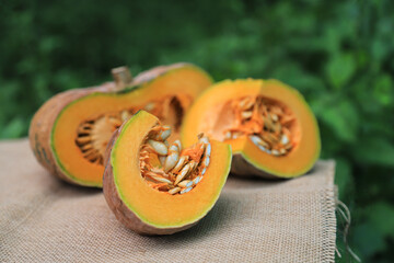 Peeling half  size of organic pumpkin from home planting for using in daily life