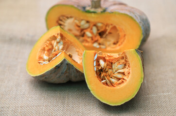 Peeling half  size of organic pumpkin from home planting for using in daily life