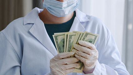 Close-up unrecognizable doctor nurse medical worker surgeon practitioner in white coat protective...