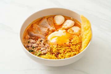 egg noodles with pork and meatball in spicy soup