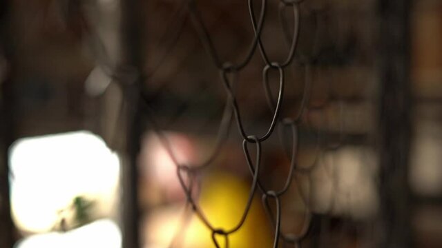Braided wire metal fence close up