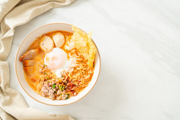 instant noodles with pork and meatballs in spicy soup