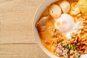 instant noodles with pork and meatballs in spicy soup