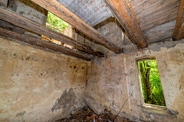 Fototapeta na wymiar Gunaros, Serbia - May 28, 2021: Indoor of The abandoned summer house 
