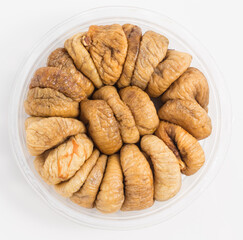 dried figs in round package isolated white background