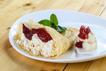 Pancake with cottage cheese and jam