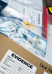 dollar bills in criminal investigation unit, conceptual image