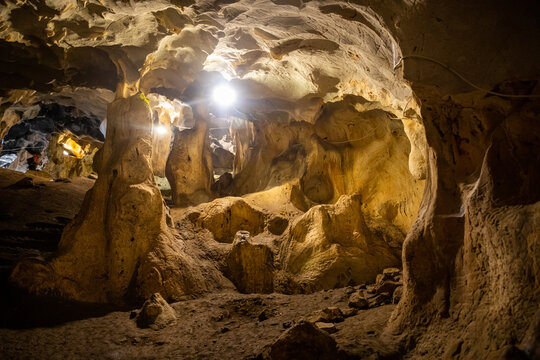 Inside view of Karain Cave in Antalya, with natural stalactites and stalagmites around in Turkey