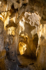 Inside view of Karain Cave in Antalya, with natural stalactites and stalagmites around in Turkey